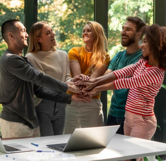 Group of students looking celebrating after submitting research paper on IJAIT